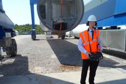 David Davies MP uses a special crane at Mabey Bridge’s manufacturing facility