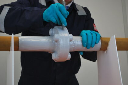 Encapsulating system being cut for inspection