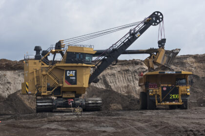 Cat 7495 HF Electric Rope Shovel loads truck