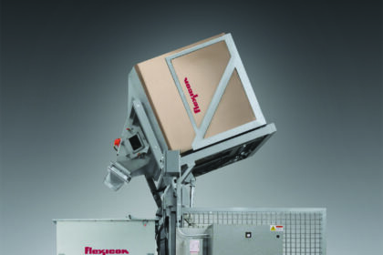 Flexicon's TIP-TITE Bulk Transfer System moves material from boxes into a mobile bin with vibratory feeder, dust-free