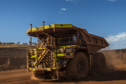 Cat 793F CMD Mining Truck leaving iron ore pit