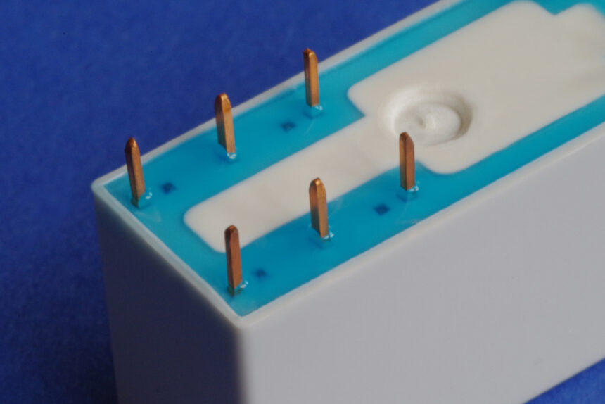 UV moisture curing blue adhesive - Panacol IMGP3389