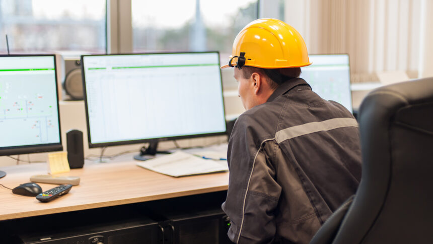 Engineer inspecting system data