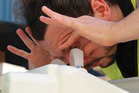 Emergency eye wash in use