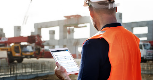 An inspector fills in a checklist at the jobsite