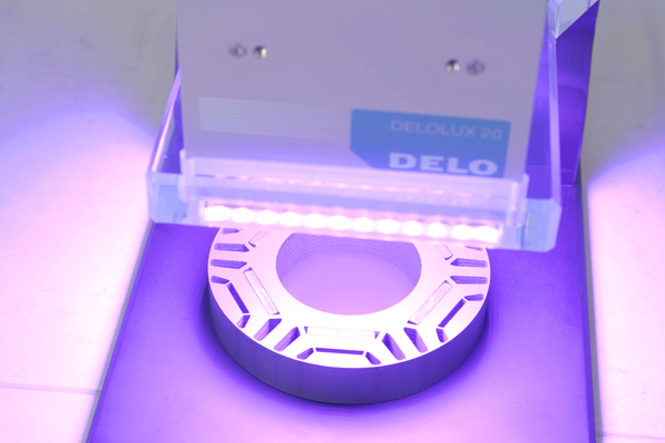 Light fixation of magnets in electric motors using a high-temperature adhesive