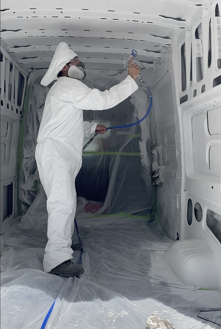 Spraying Mascoat on van interior