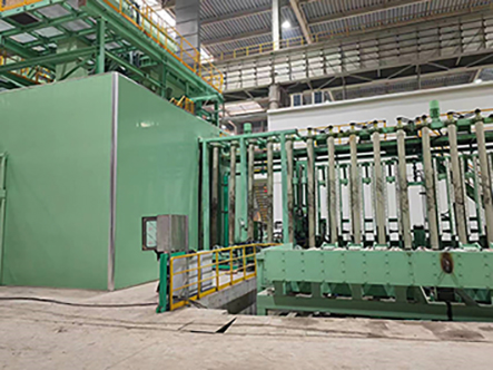 Directly in front of the shot blasting system the stainless steel plates are moved into a vertical position. They are then passing through the shot blast system and pickling line on special roller conveyors
