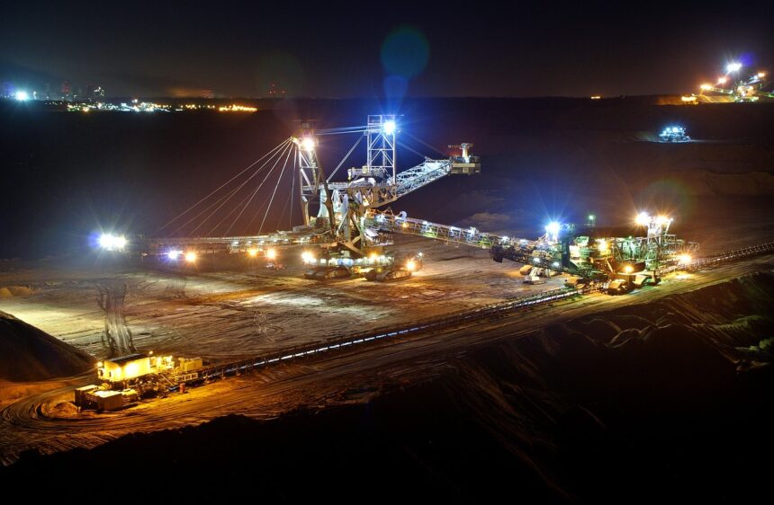 Open pit mining at night. Image credit: Pixabay.