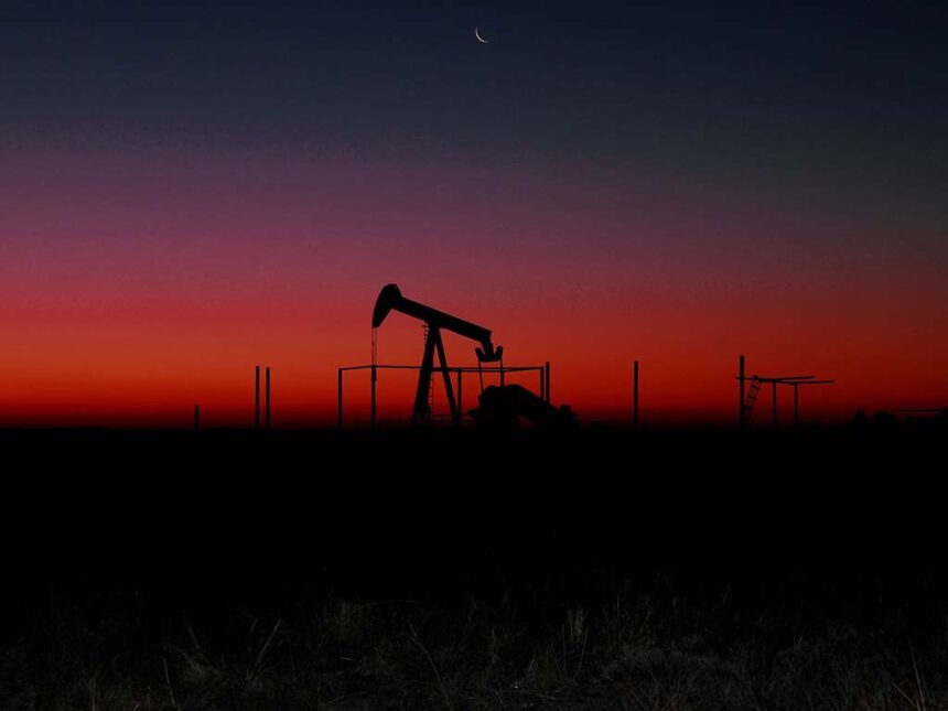 Oil rig seen at sunset.
