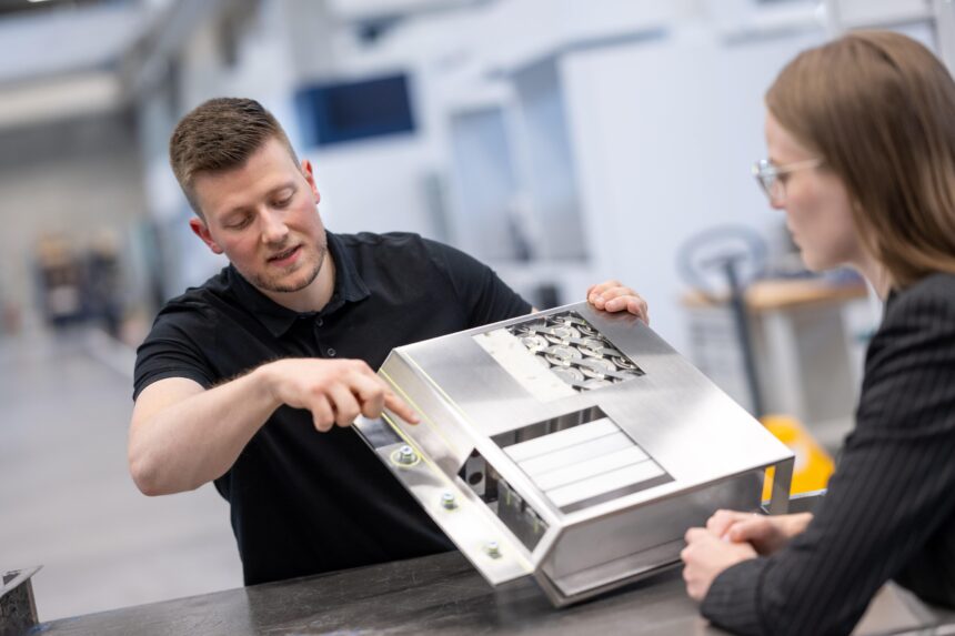 A TRUMPF employee explains where the battery will be cut open by the laser