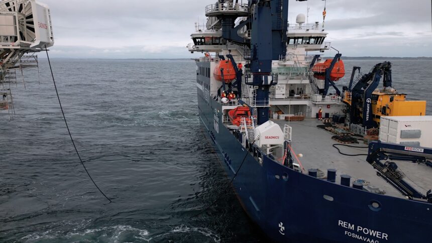 A photo of the cable charging a boat at sea