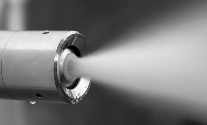 The image shows an ultrasonic atomisation nozzle
