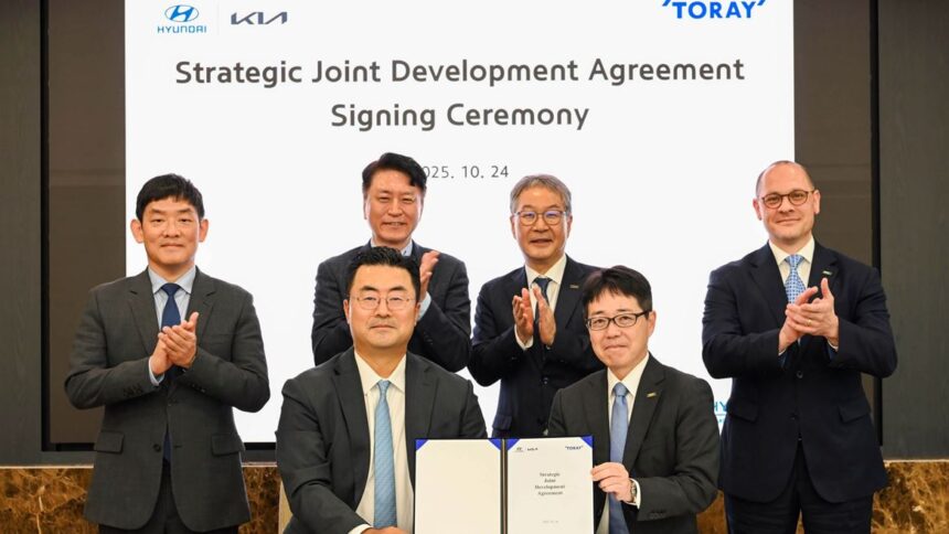 The signing took place on October 24, image via Kia Automotive